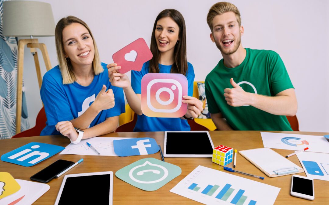 Woman holding snapchat logo with his friends showing thumbup sign